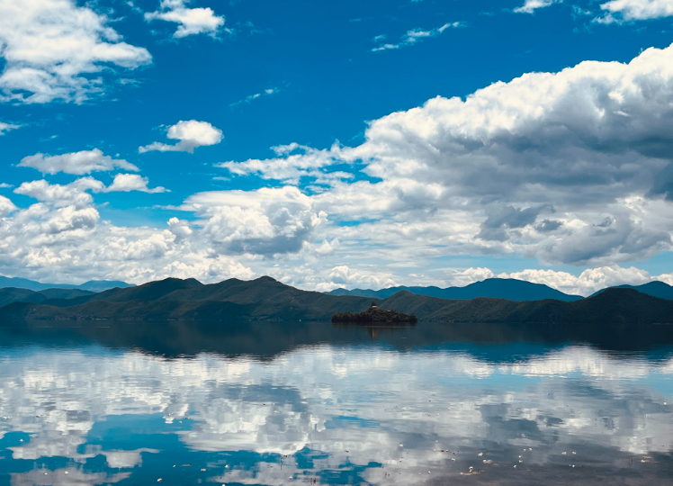 Blue sky and mountains reflected in a lake