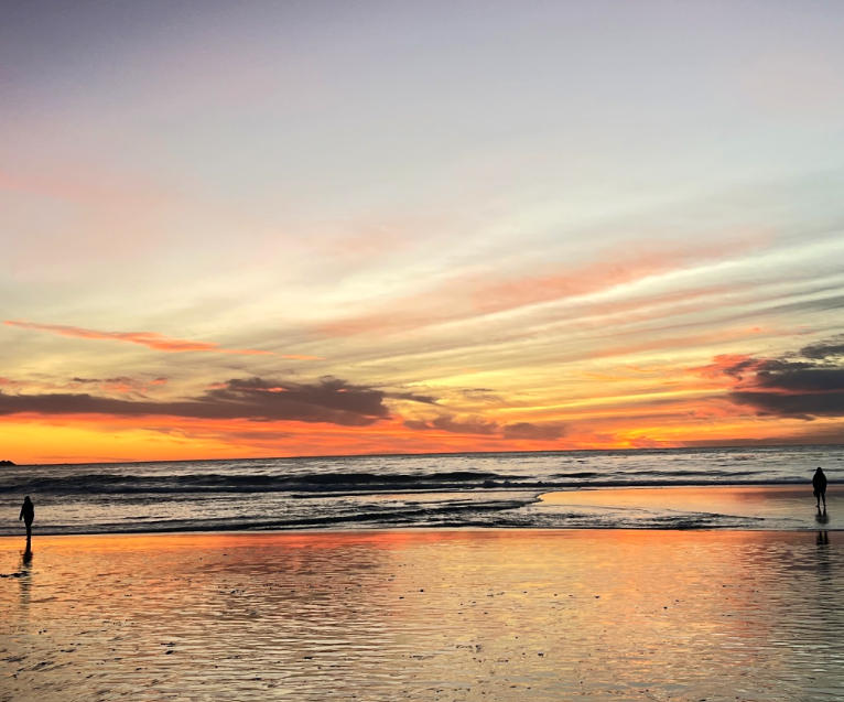 Warm sunset reflected across the shoreline